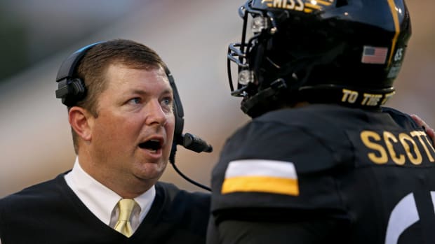 Gerquan Scott (right) with Southern Miss head coach Will Hall.